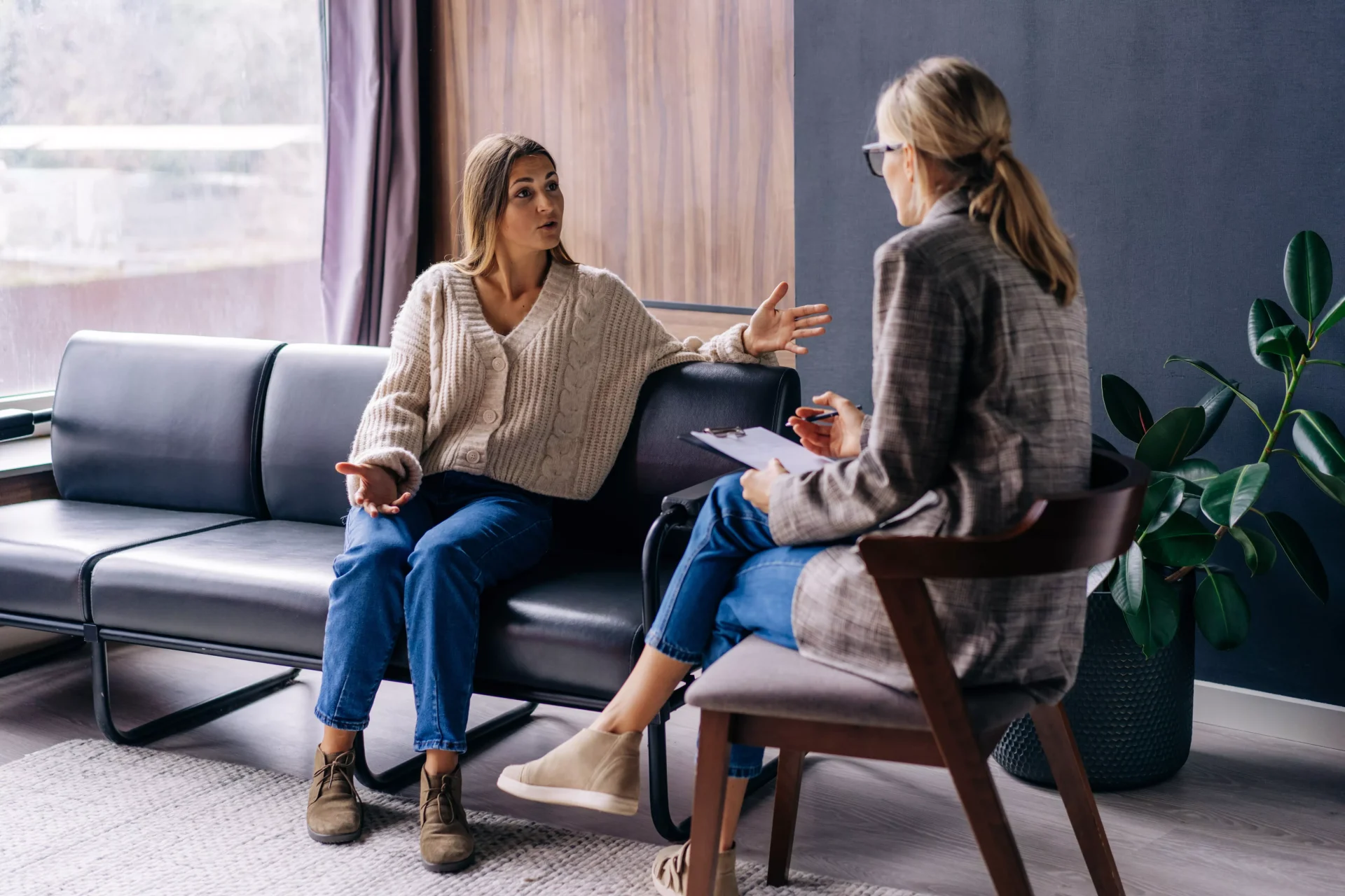 Psychologist speaking with a client during a health anxiety therapy session